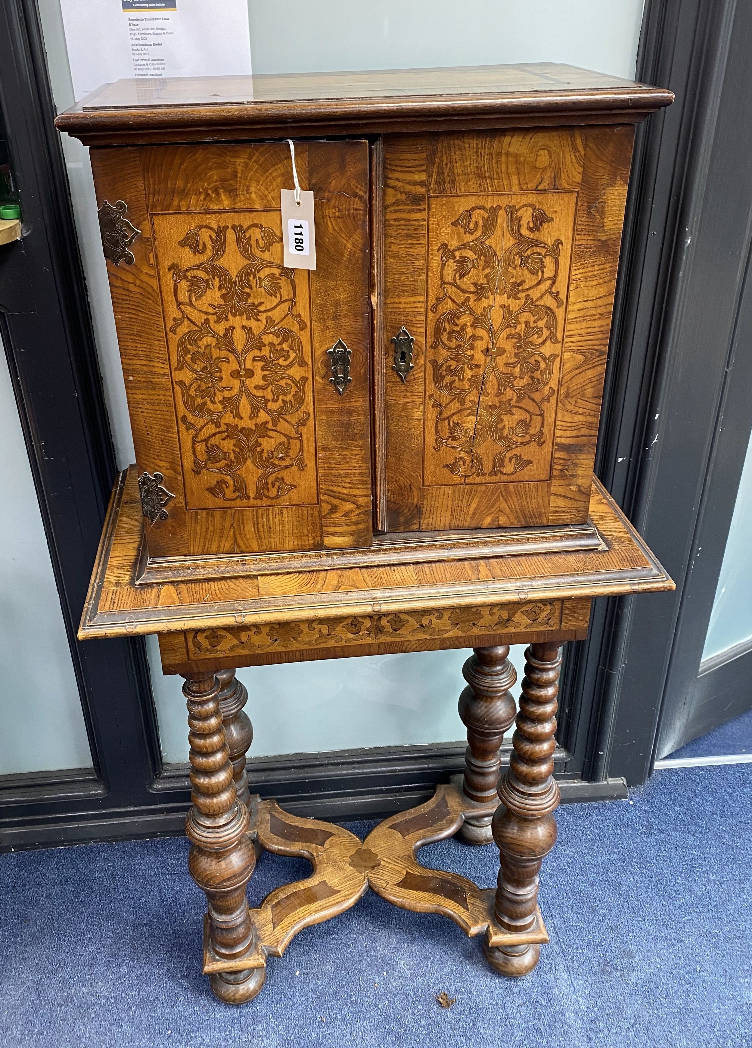 A Continental marquetry cabinet on stand, width 65cm, depth 36cm, height 126cm